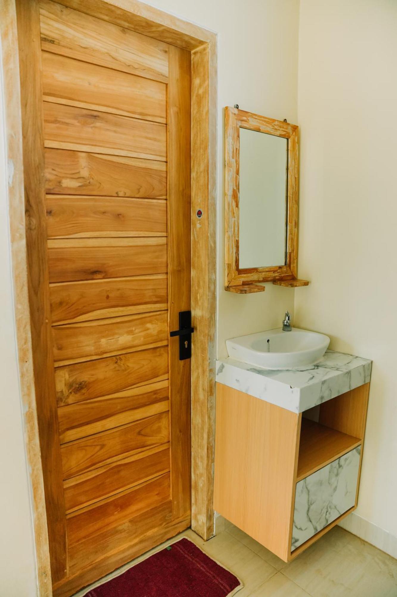 Taman Asih Bingin Homestay Улувату Номер фото